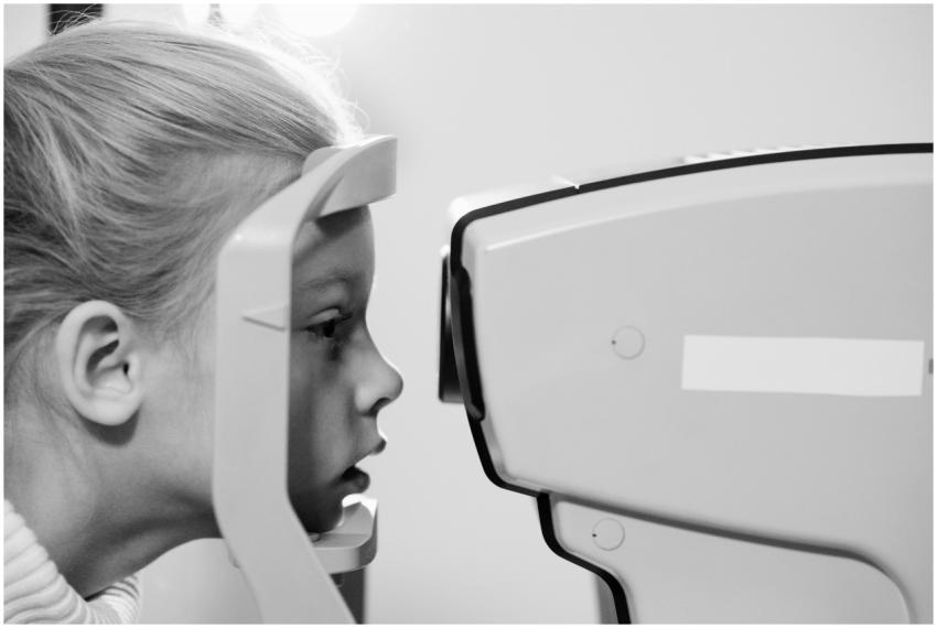 A young girl undergoes an eye examination using ad