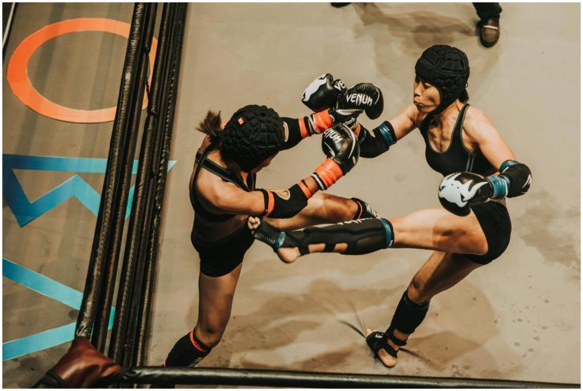 Two female athletes engaged in intense martial art