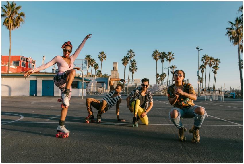 A lively group enjoying roller skating under the s