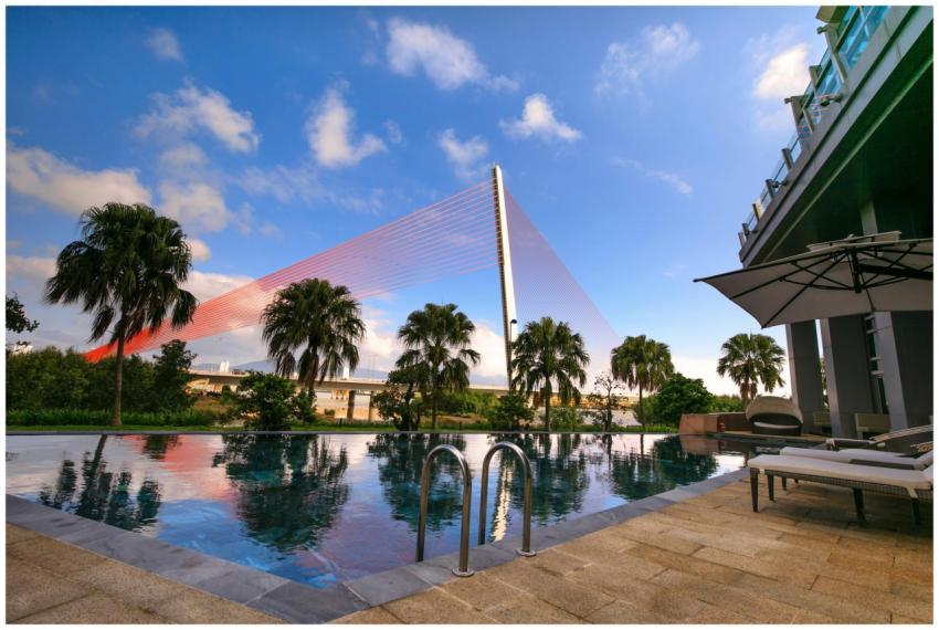 Relax at a luxurious resort poolside with scenic v