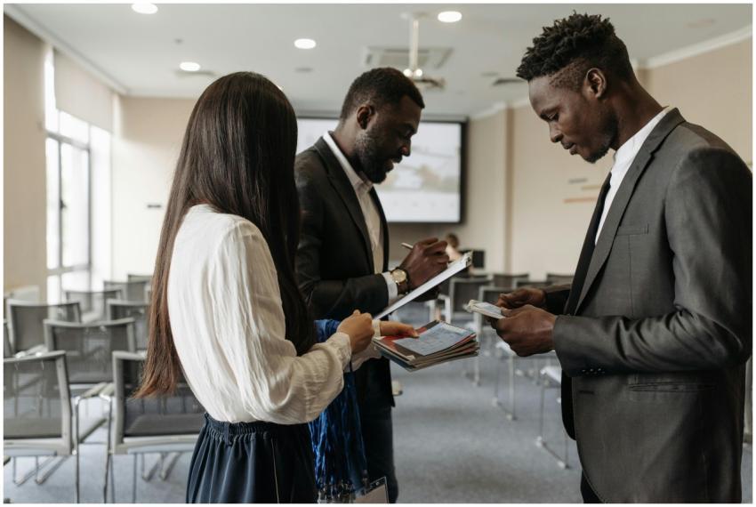 Three business professionals engaged in discussion