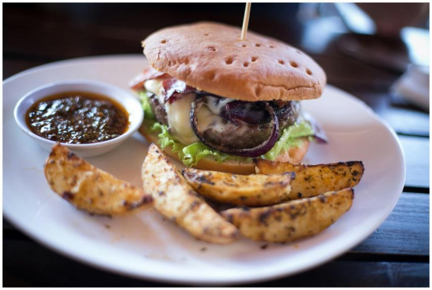 Close-up of a delicious cheeseburger with potato w