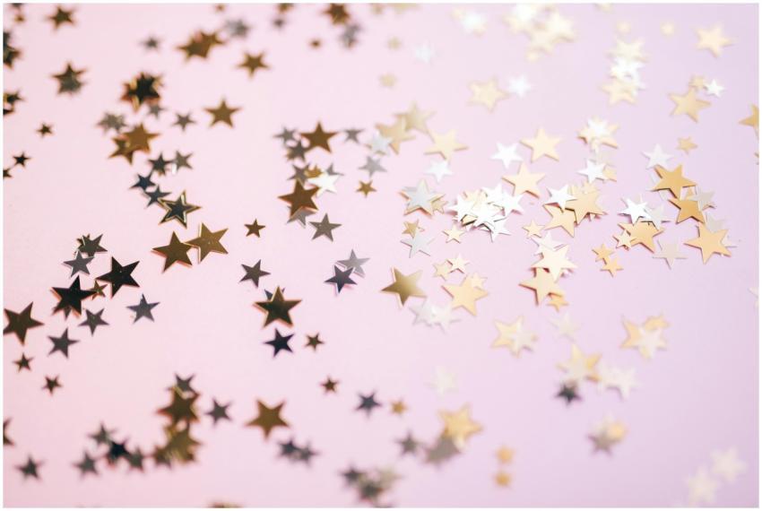 Gold and silver star confetti spread across a past