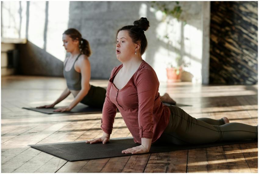 Women practicing yoga indoors, focusing on wellnes