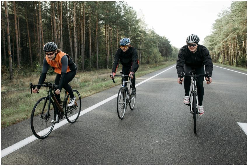 Three cyclists are enjoying a ride on a scenic for