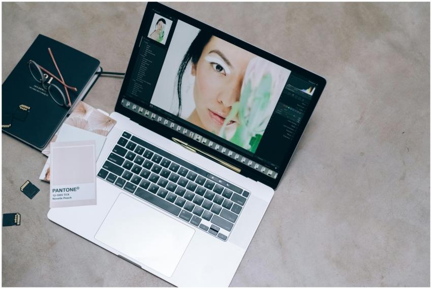 High-angle view of a creative workspace with a lap