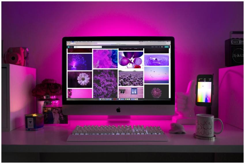 Modern desk setup with neon lighting and a desktop