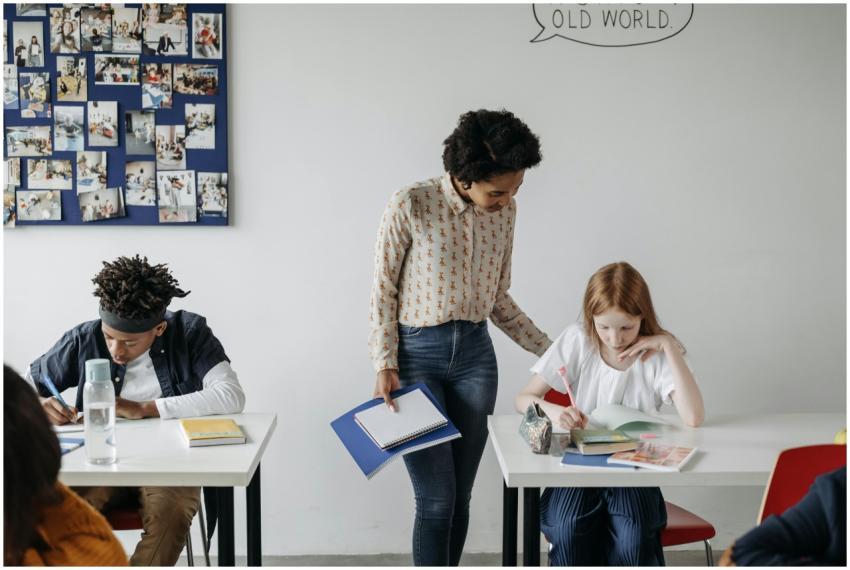 A teacher guides students during a classroom activ