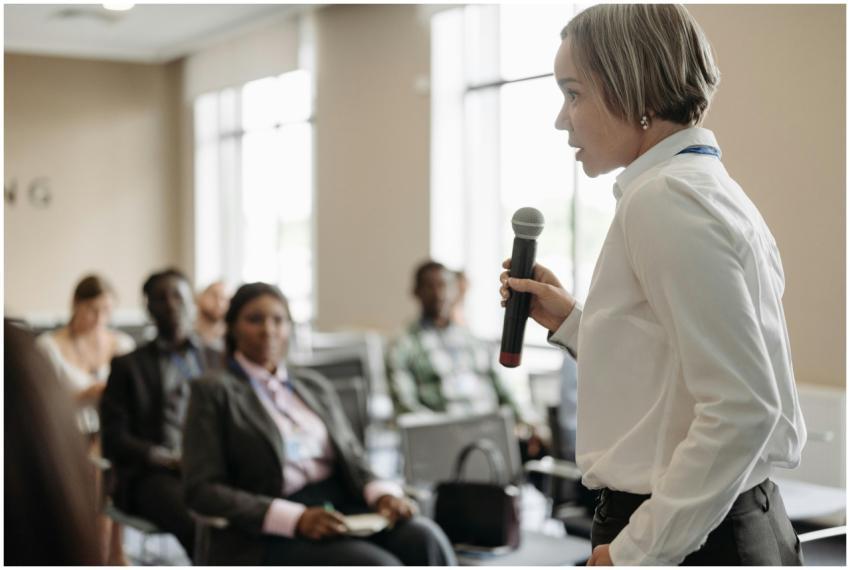 Side view of a businesswoman holding a microphone