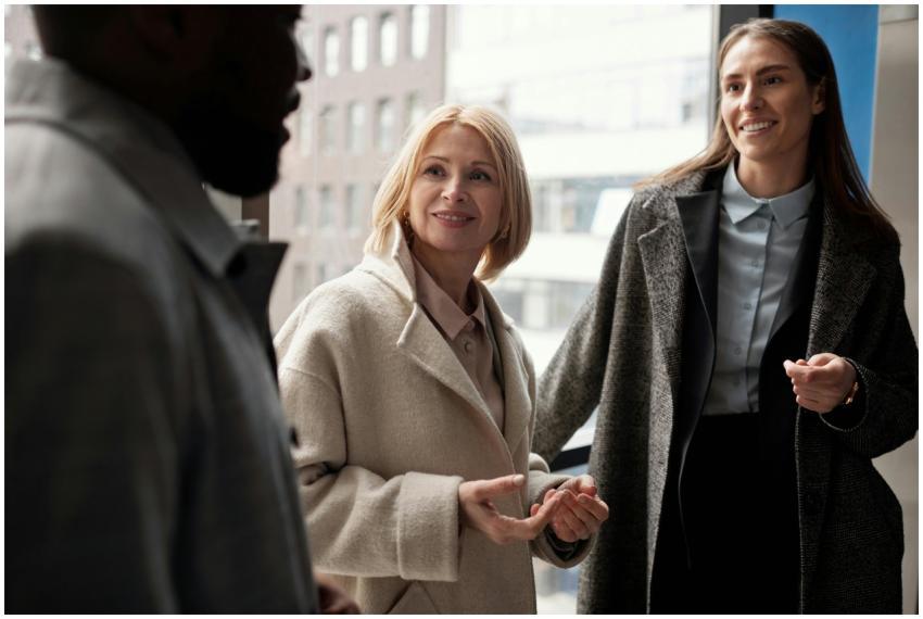 A diverse group of business professionals conversi