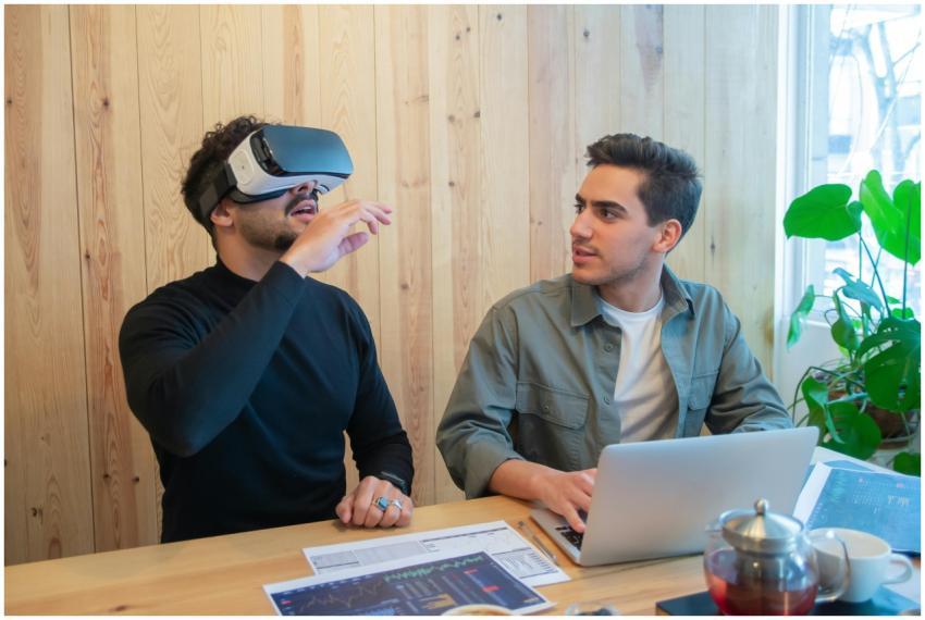 Two colleagues engage in a tech-savvy business mee