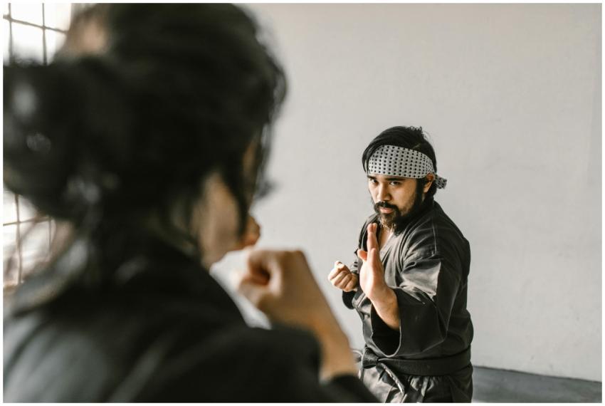 Two martial artists practicing self-defense techni