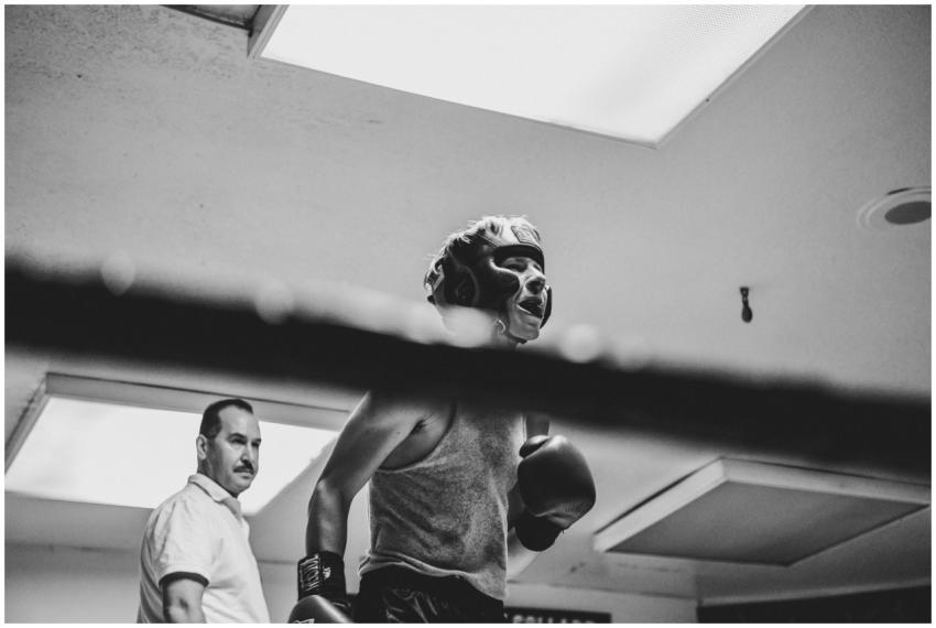 Dramatic black and white photo of a boxer training