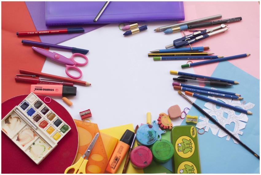 A vibrant selection of school supplies on a desk,