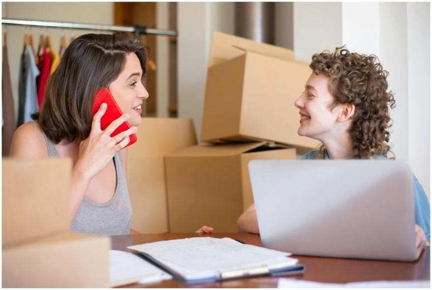 Two women managing their online clothing store usi