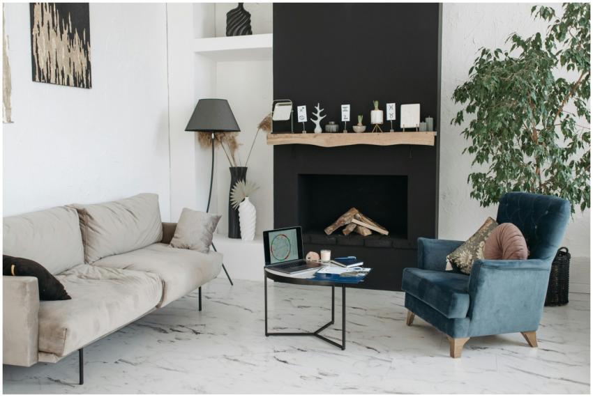 Spacious living room with a fireplace, armchair, a