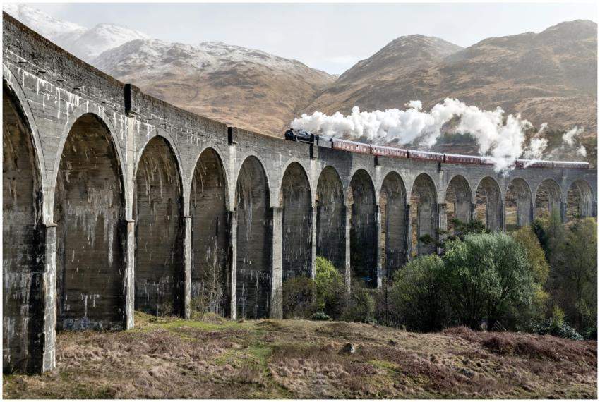 Scenic view of a steam train crossing the Glenfinn