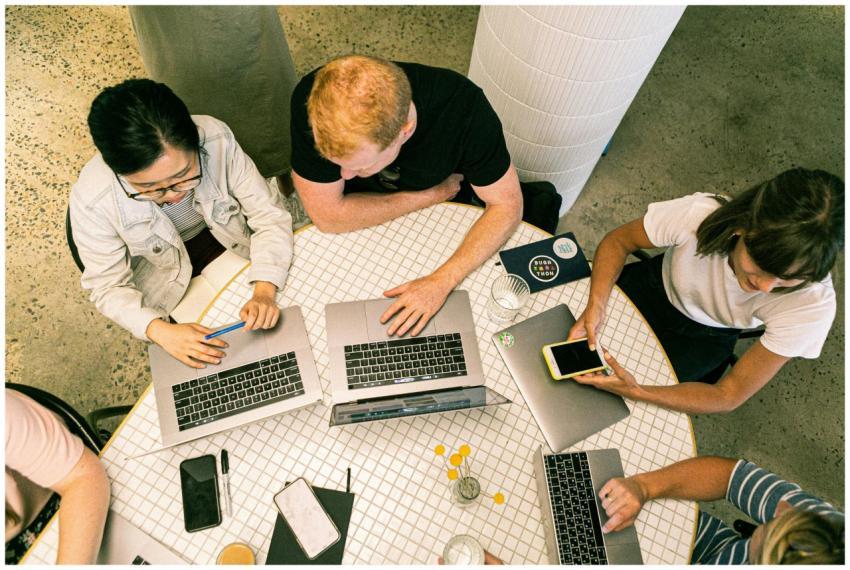 Top view of diverse team collaboratively working i