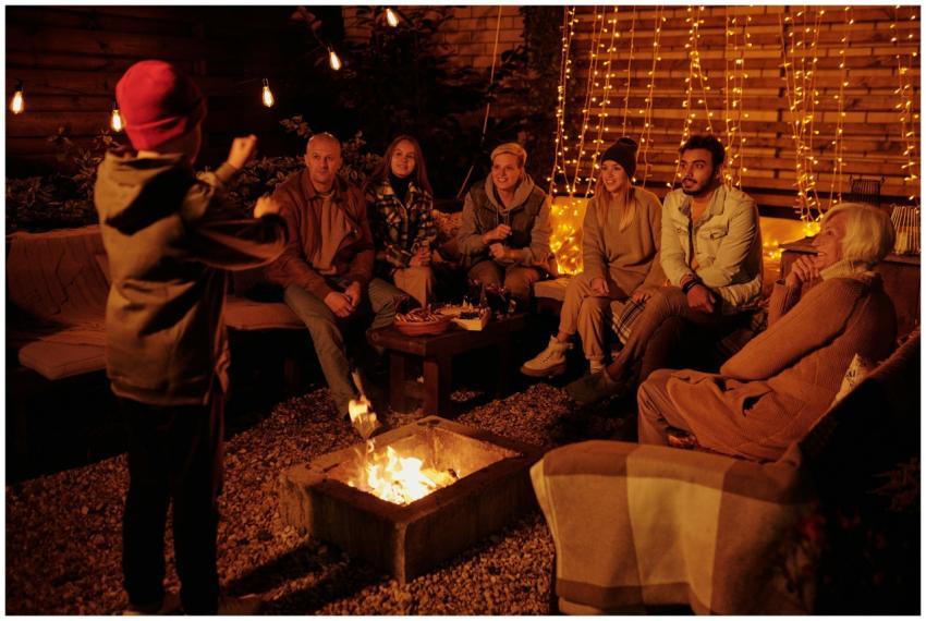 Boy acting out charade word while playing with fri