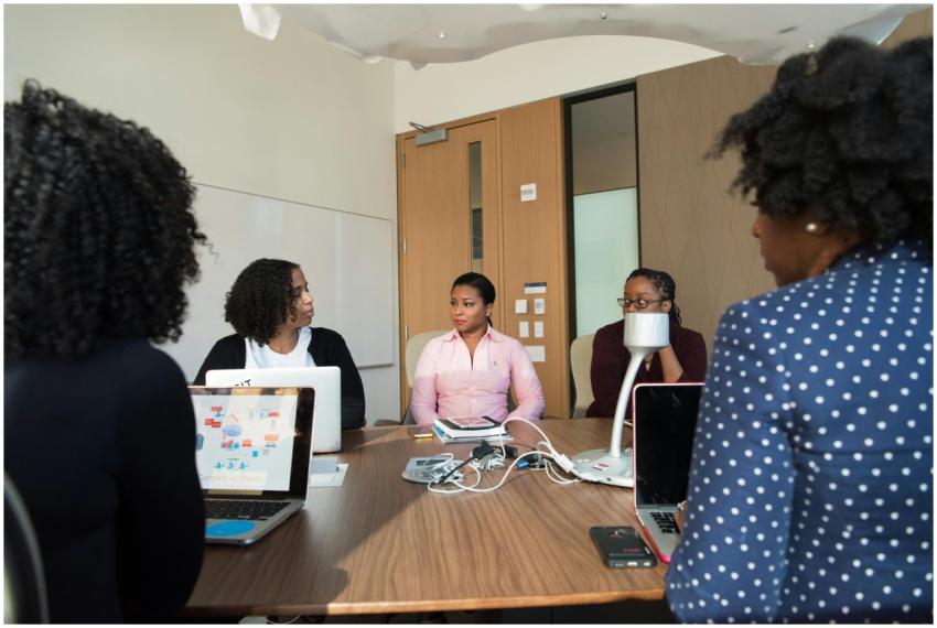 Diverse team of adults collaborating in a meeting