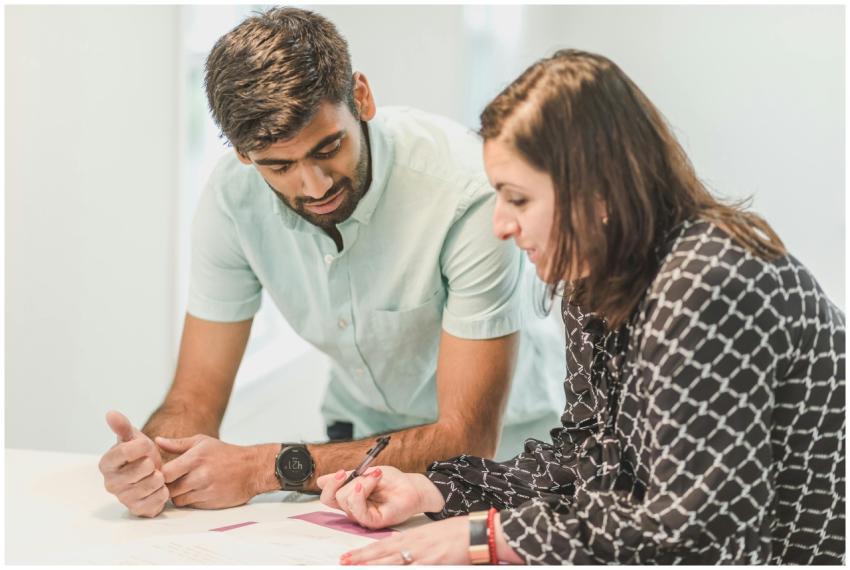 A real estate agent assists a client with home buy