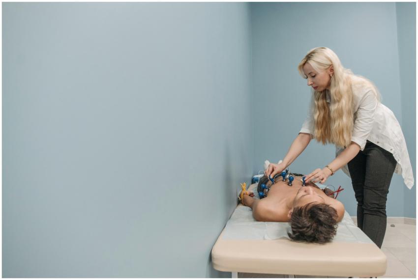 A healthcare professional performs an electrocardi