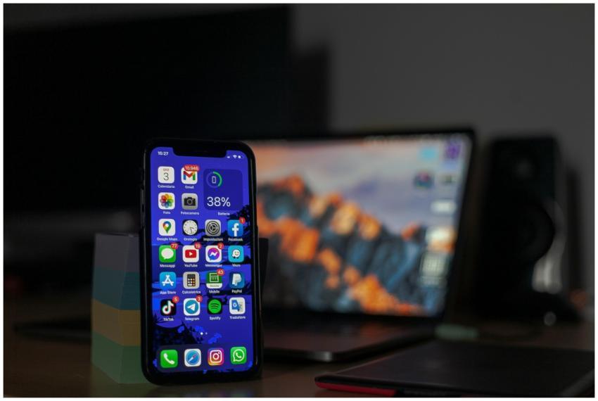 Smartphone displaying various apps in focus with a