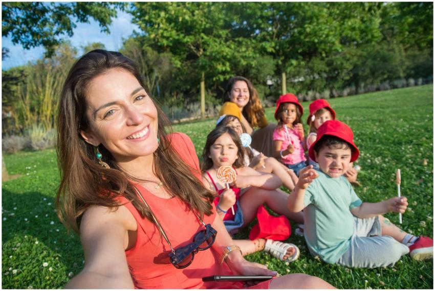 Smiling group enjoying a sunny day taking a selfie