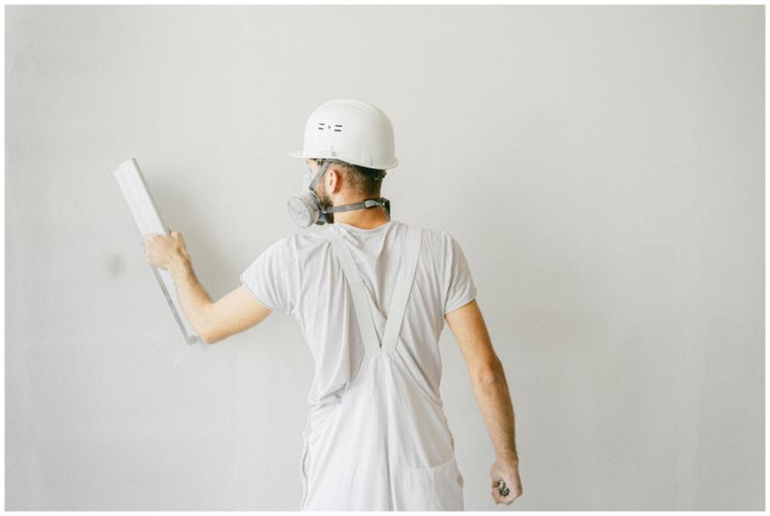 Back view of a construction worker in safety gear