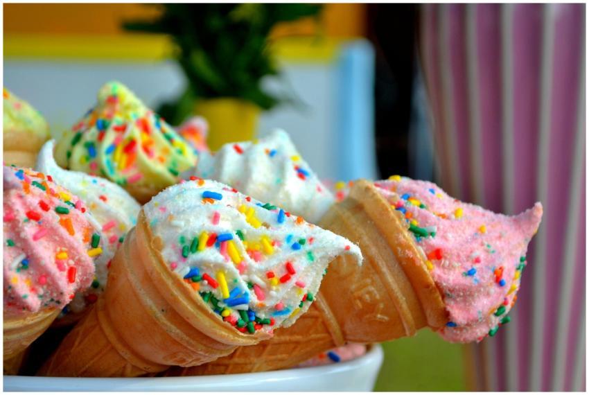 Vibrant ice cream cones topped with colorful sprin