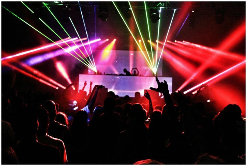 Energetic nightclub scene with laser lights and a