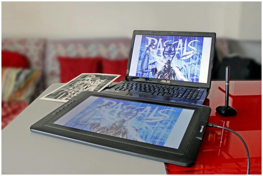 Digital drawing setup with laptop and tablet for m