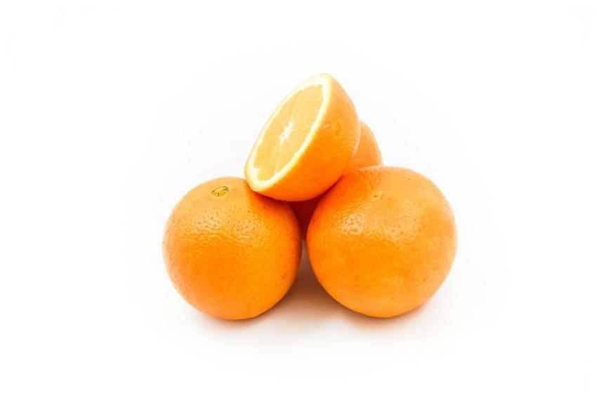 Bright and fresh oranges displayed on a white back
