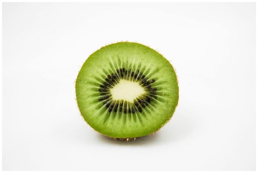 Close-up of a fresh kiwi fruit slice showcasing it