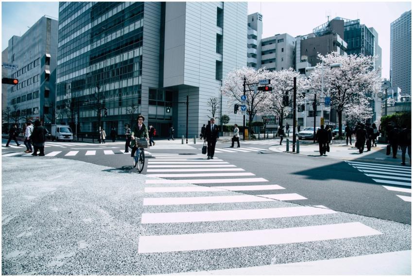 Pedestrians crossing a busy intersection in Nagawa