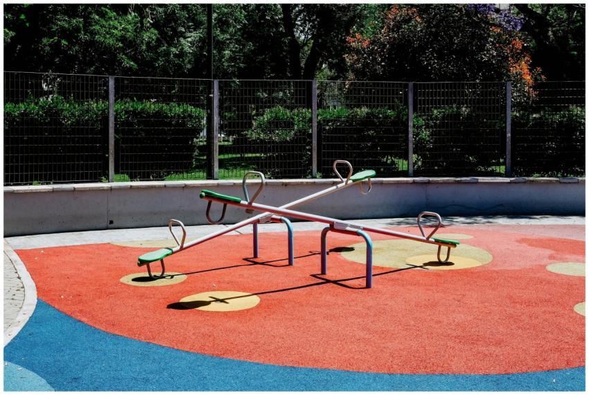 Empty seesaw in a vibrant Buenos Aires playground