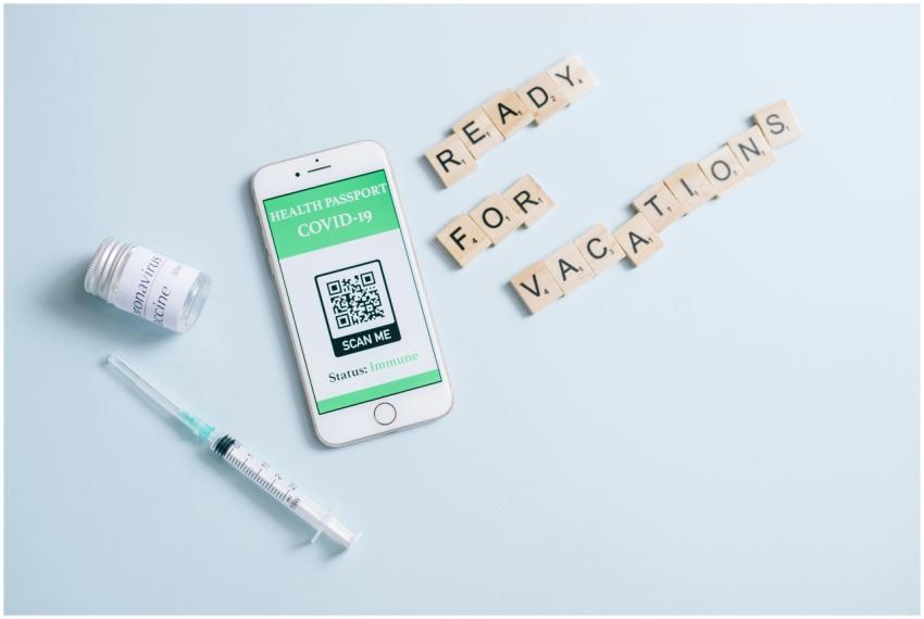 Smartphone displaying COVID-19 health passport wit