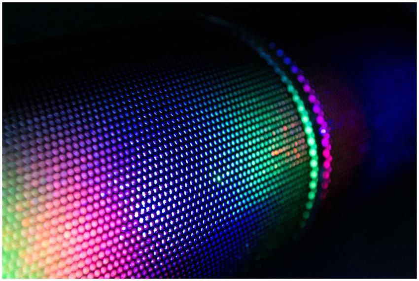 Close-up of a wireless speaker with colorful RGB l