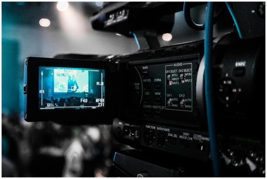 HD video camera capturing a live event; focus on s