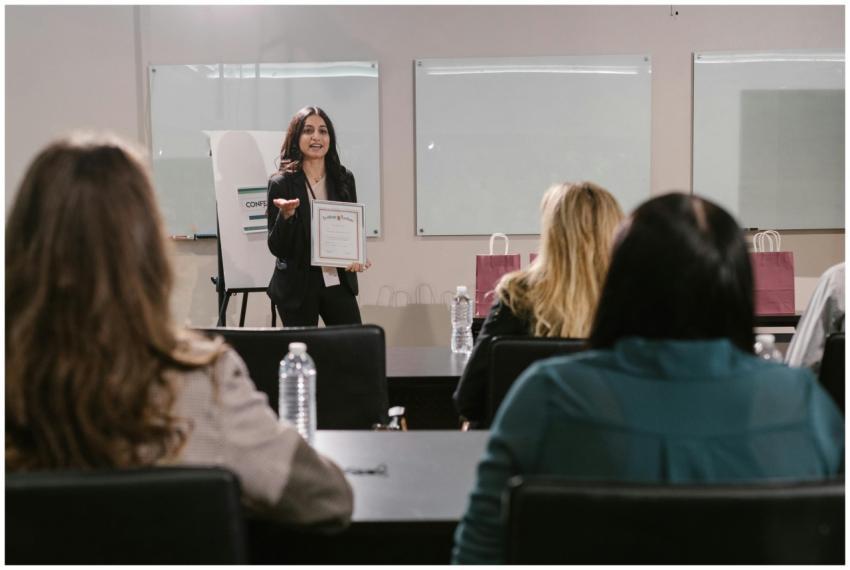 A business seminar showcasing a female presenter a