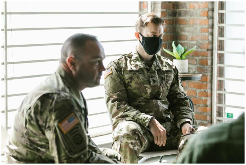 Two military personnel in a therapy session focuse