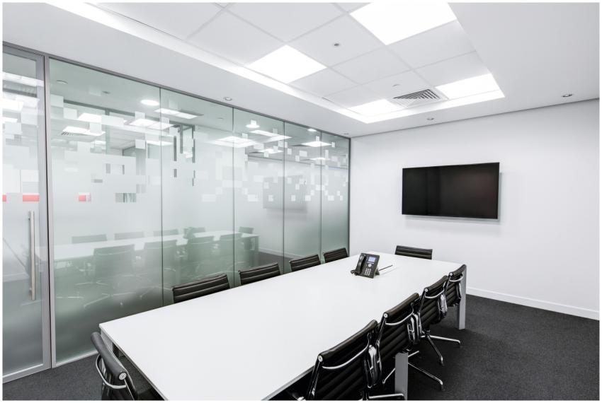 Sleek, minimalist conference room with glass walls
