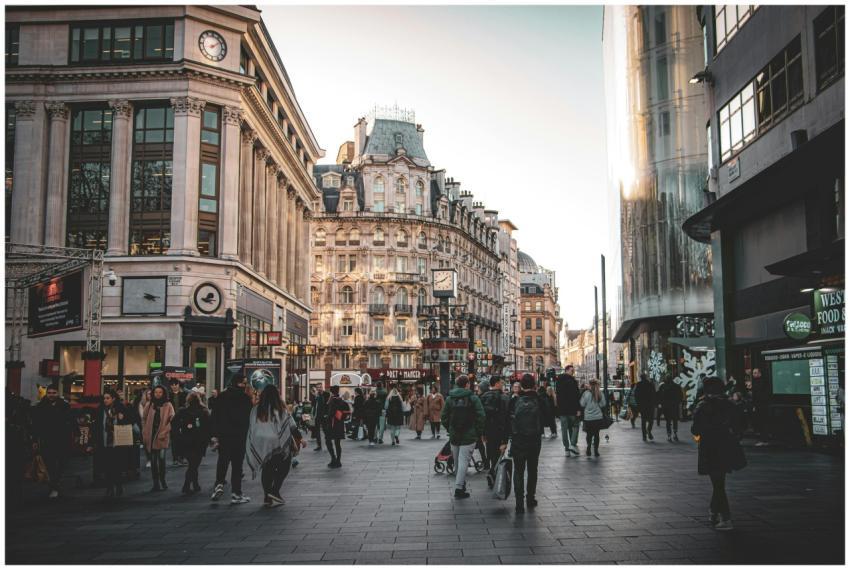 A vibrant street in London with pedestrians and hi