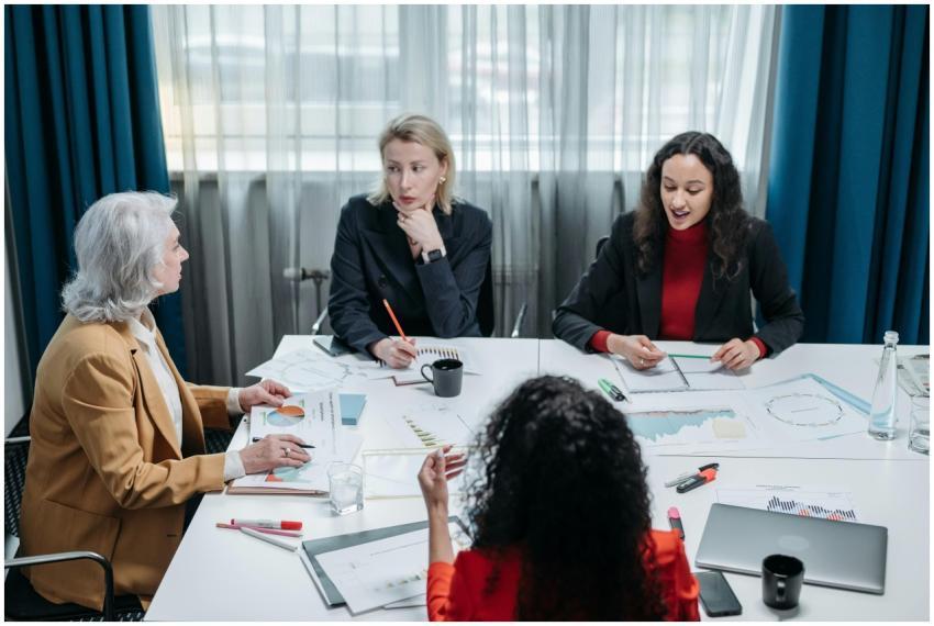 Four professional women engaged in a productive of