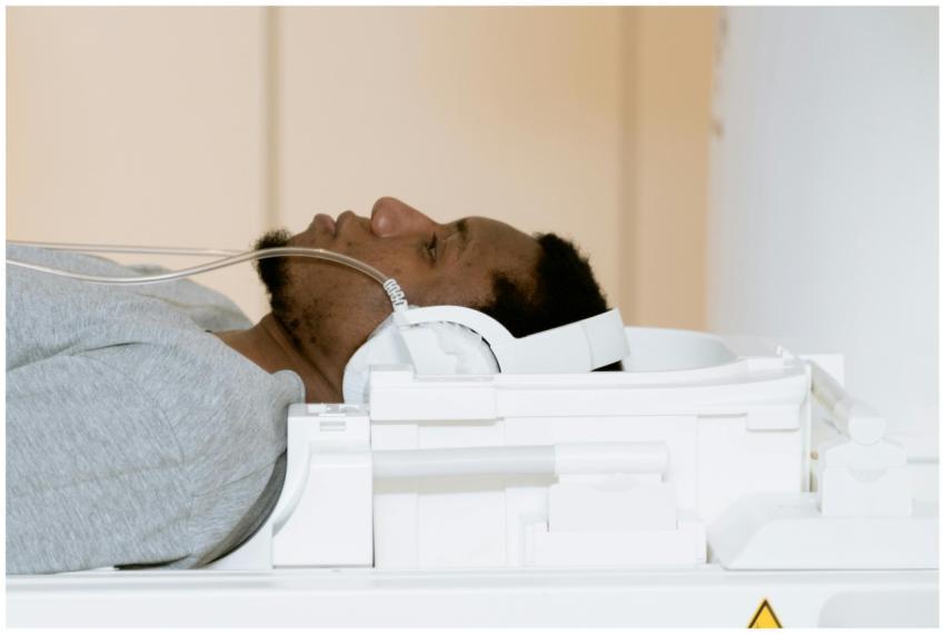 A patient is lying inside an MRI scanner for a med