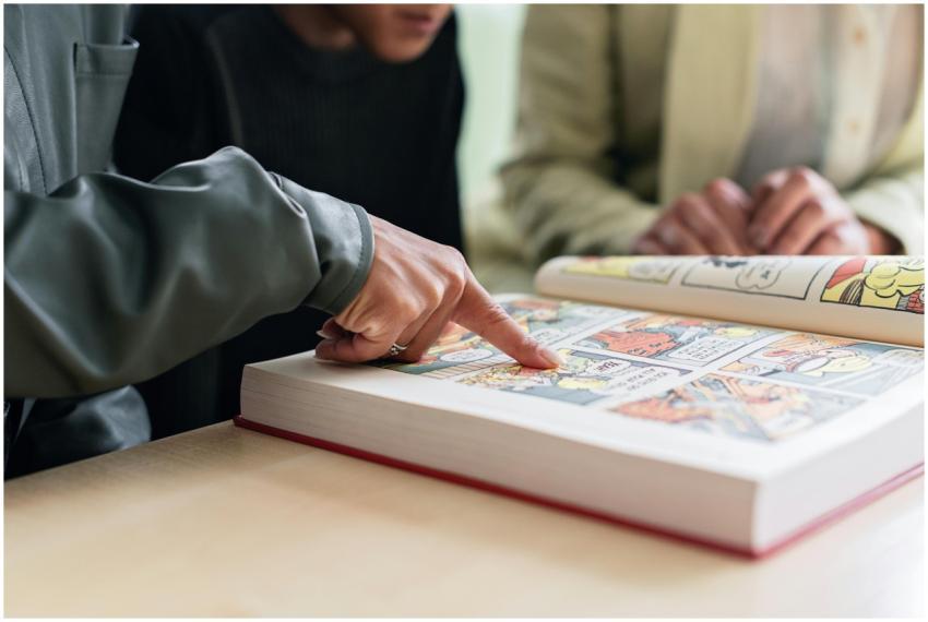 Two individuals focus on reading a colorful comic