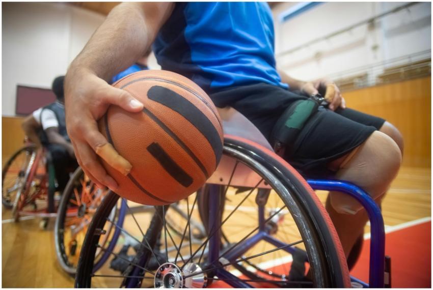 Close-up of an athlete with a basketball in a whee