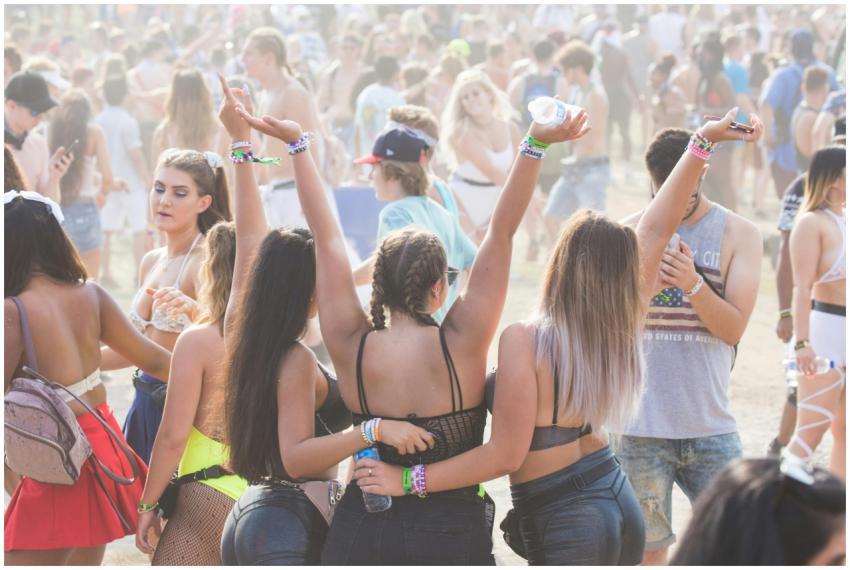 Energetic crowd enjoying an outdoor festival with