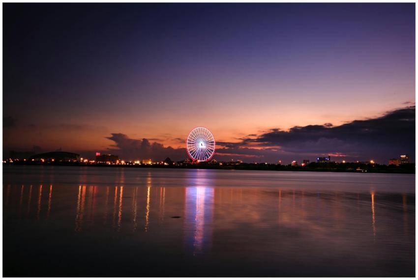 Capture the beauty of an illuminated ferris wheel