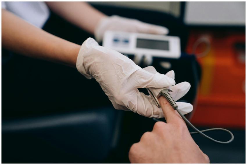 Close-up of a healthcare professional using a puls